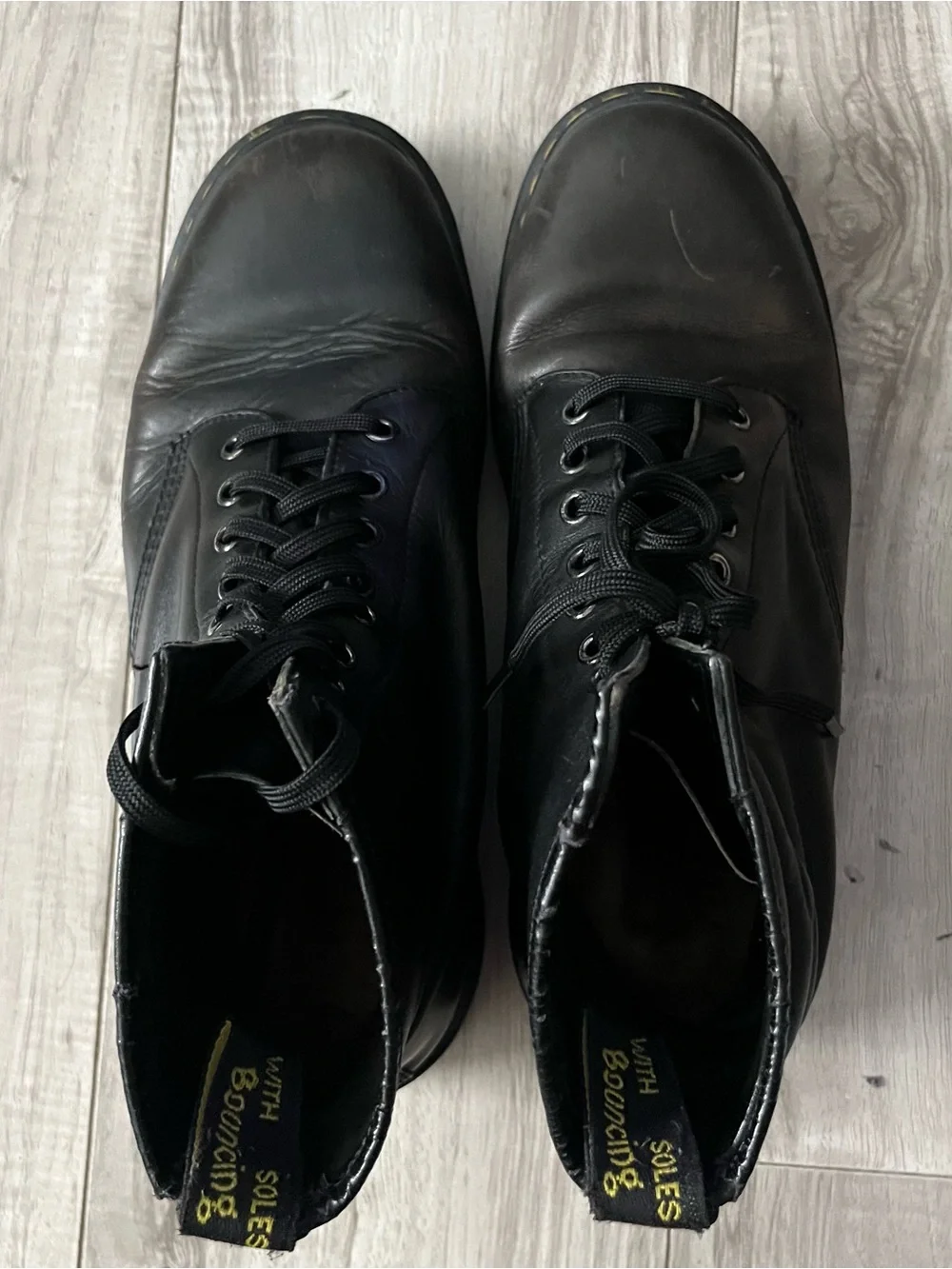 Dr. Martens Black Leather Lace-Up Combat Boots with Yellow Stitching